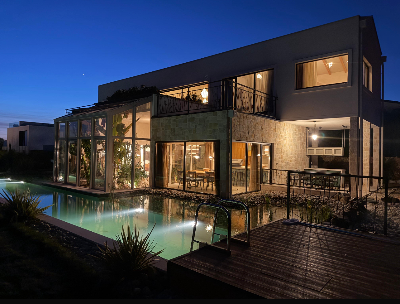 Villa at night — pool illuminated