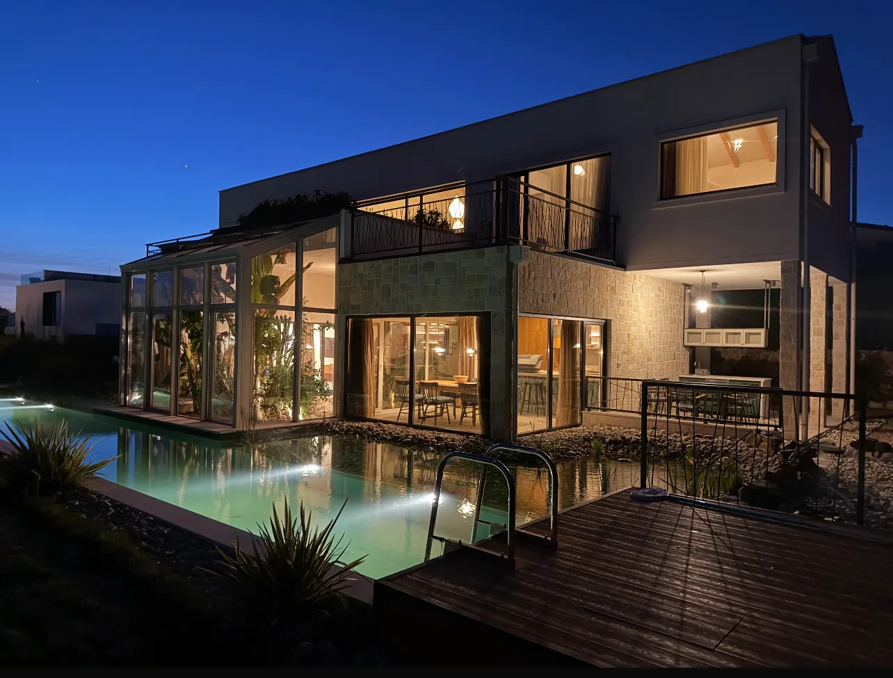 Villa at night — pool illuminated